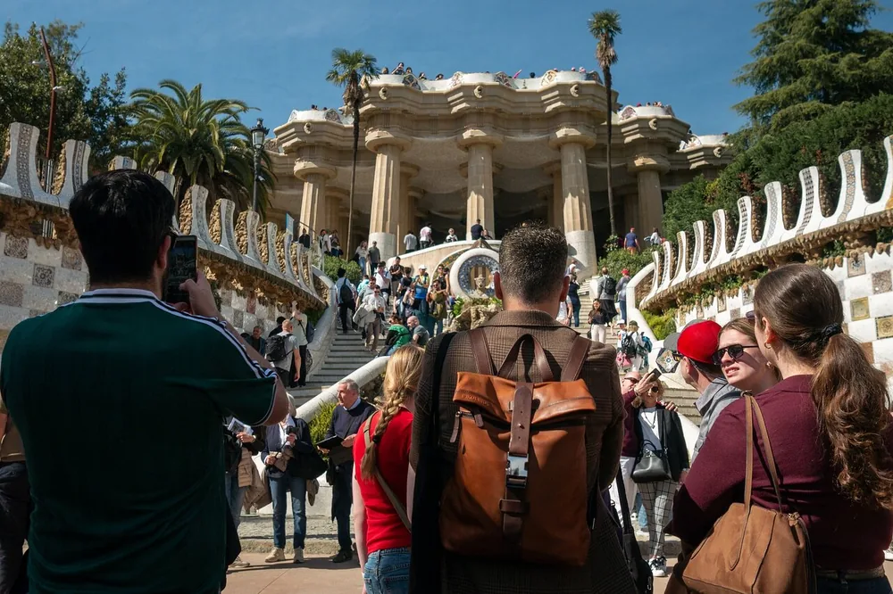 Crowds on the main stairway at the Park Güell entrance